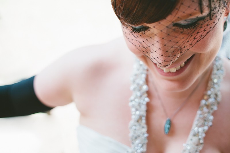 bride with black birdcage veil