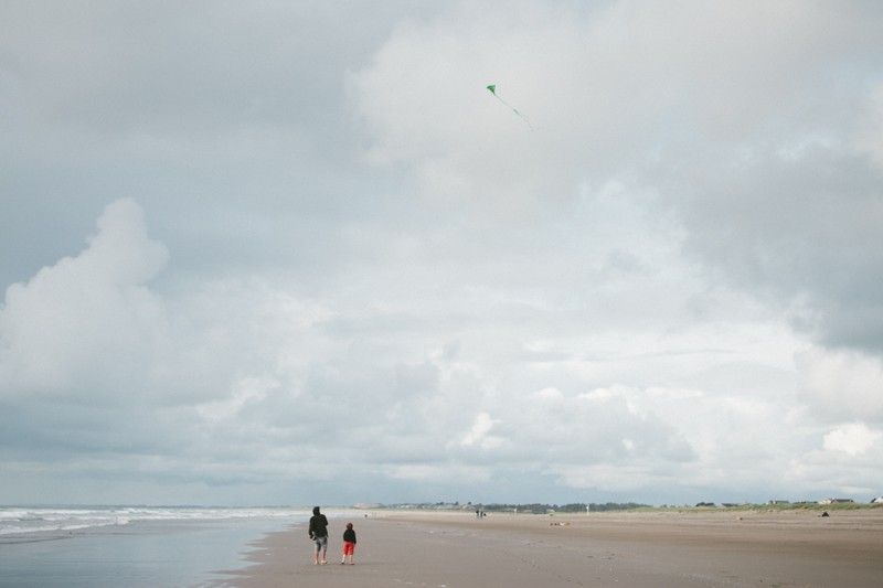 flying kites in seaside, or