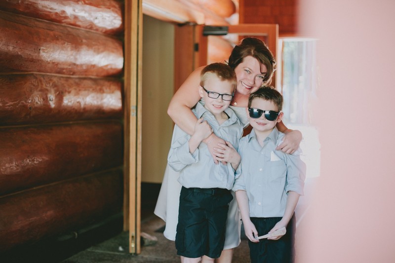 Bride hugging her two children before the wedding. 