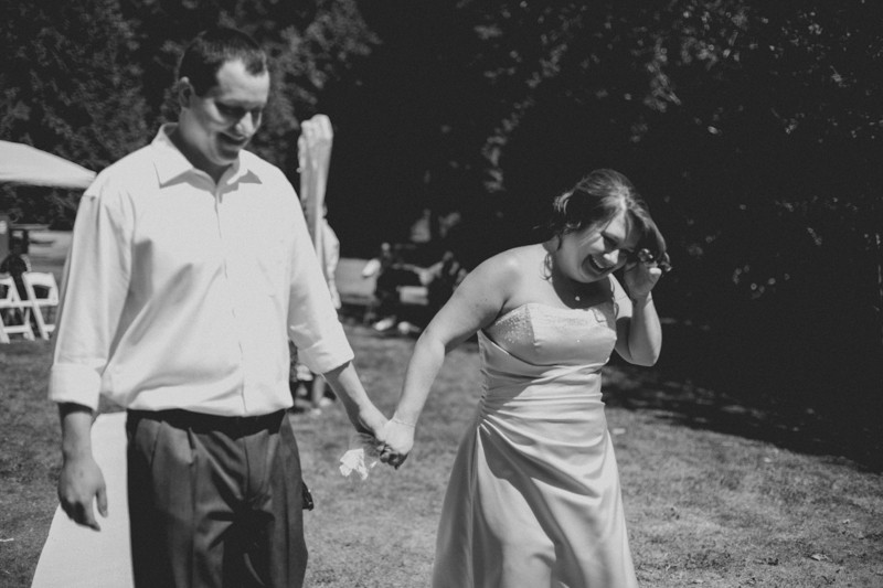 Bride and groom holding hands after the ceremony. 