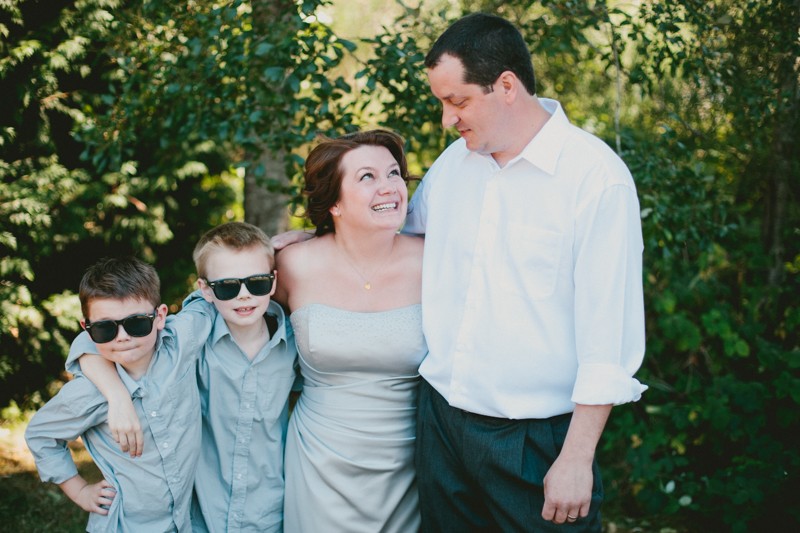 Family portrait of bride, groom and their two sons at Island Lake Park in Silverdale, WA.