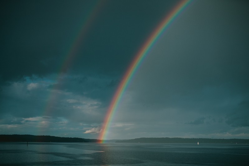 Double rainbow over a sailboat in Kitsap County, Washington.