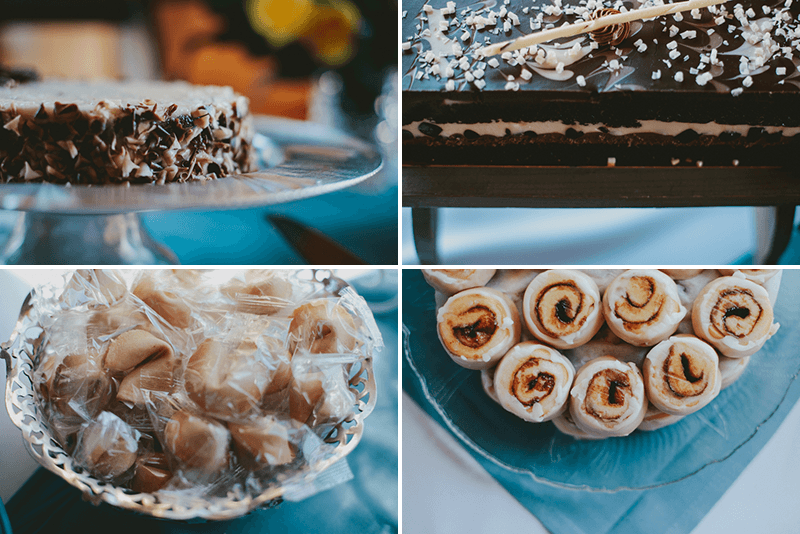 Dessert table with fortune cookies, chocolate cakes, and mini cinnamon rolls. 