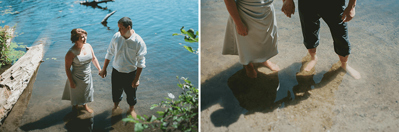 Bride and groom standing barefoot in the water at Island Lake Park in Silverdale. 