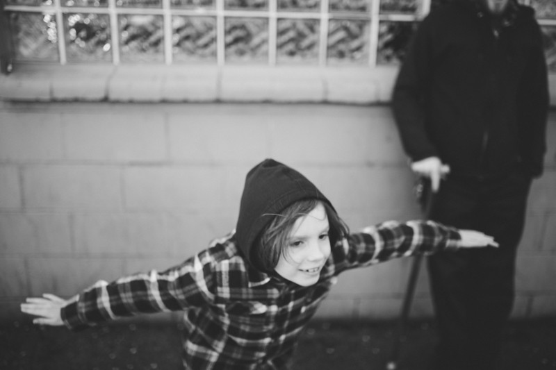 Bainbridge Island lifestyle portrait of a boy pretending to fly. 