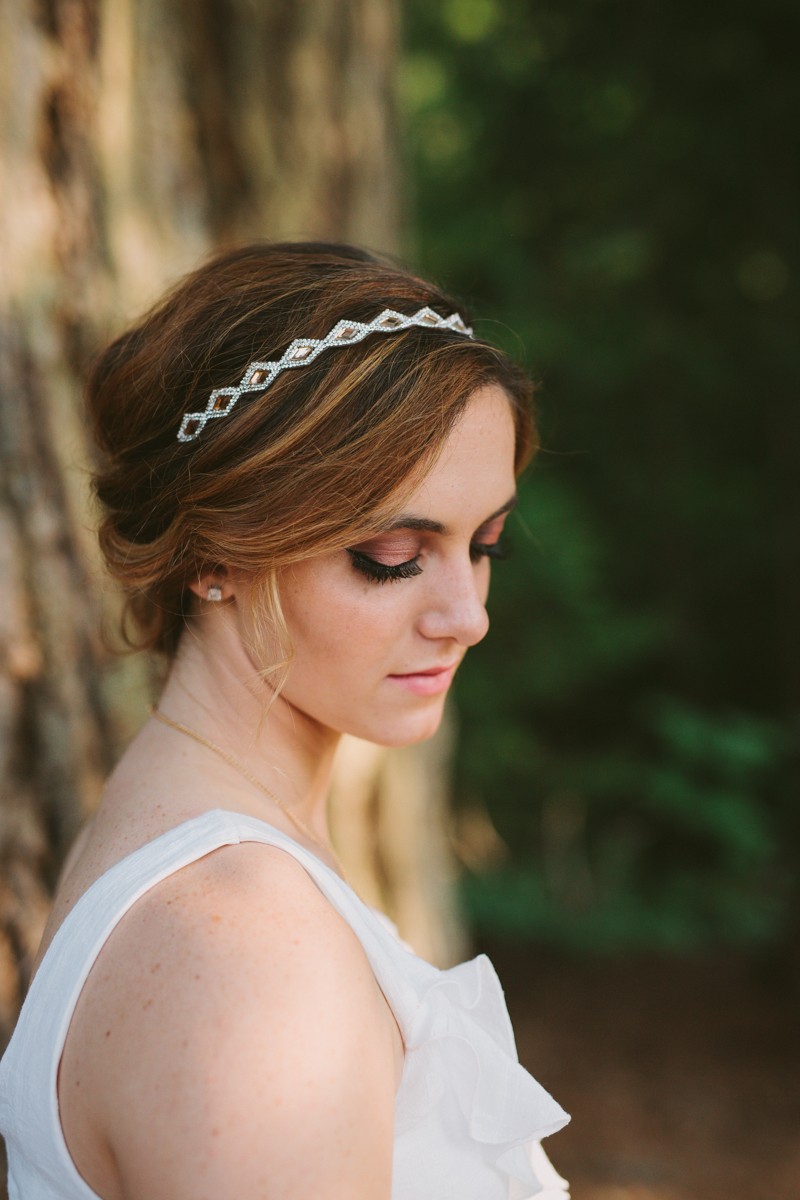 Class of 2016 senior girl with a formal up-do hairstyle, and a jeweled headband, in a white dress, at Scenic Beach State Park, by Meghann Prouse, Photographer. 