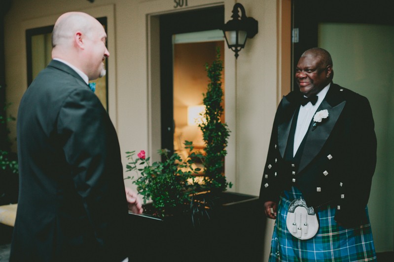 Emotional first look moment, with groom in a peak lapel suit jacket and traditional kilt, at Hotel Ballard. 