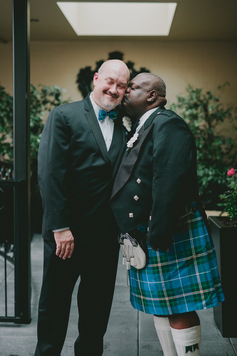 Two dapper grooms in bow ties at Hotel Ballard in Seattle, Washington. 