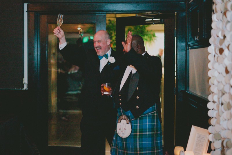 Same sex couple arriving to wedding reception. 