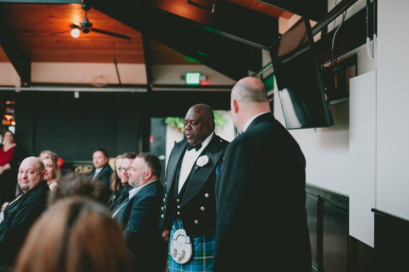 Grooms walk together down the aisle at Olympic Rooftop Pavilion. 