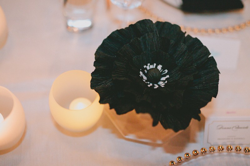 Handmade black paper flower table decor, with LED tea light candles. 