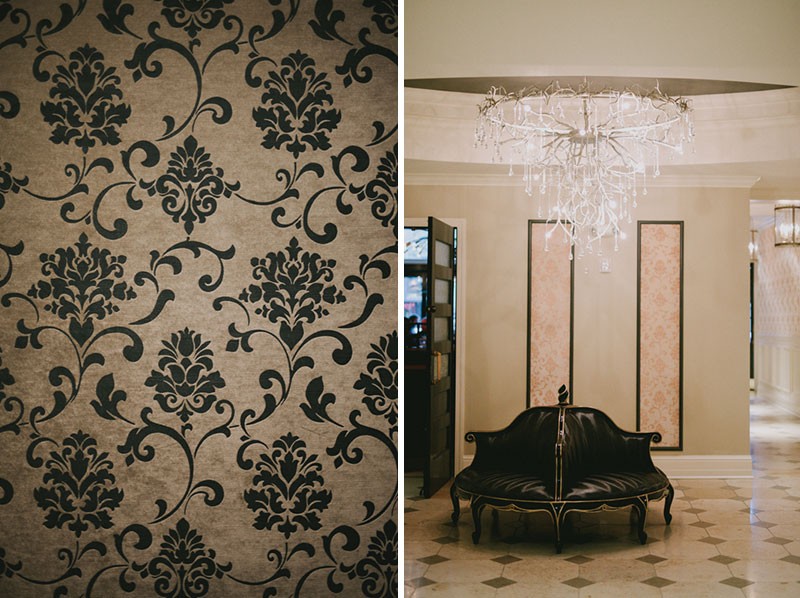 Hotel Ballard lobby detail, with modern chandelier, ornate sectioned chair, and damask wall paper. 