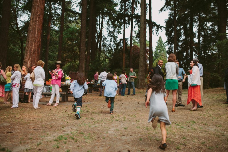 Kids running, having fun at a Seattle Lincoln Park wedding. 