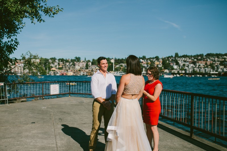 Simple outdoor wedding ceremony, with groom wearing khakis and a white button front shirt. 