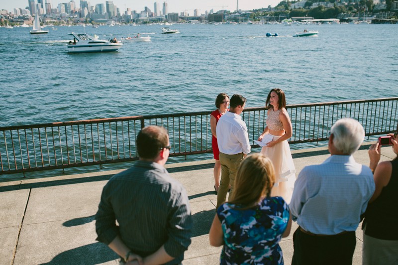 Small summer wedding ceremony, with boaters passing by on Lake Union after Sea Fair.