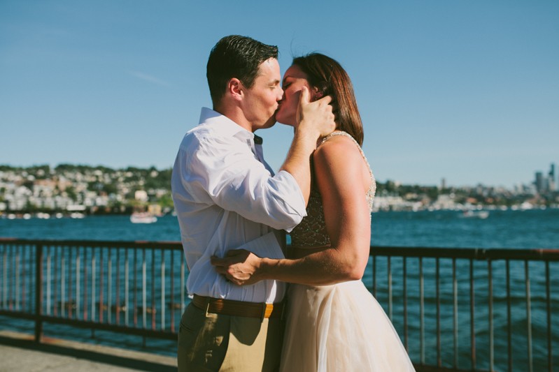 Bride and groom kiss after exchanging vows. 