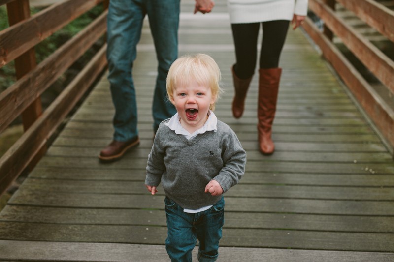 Happy toddler during a family photo session along the downtown Poulsbo waterfront. 