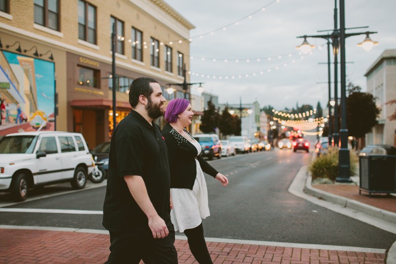 Downtown Bremerton engagement session with modern couple in black and white, and bride with purple hair. 