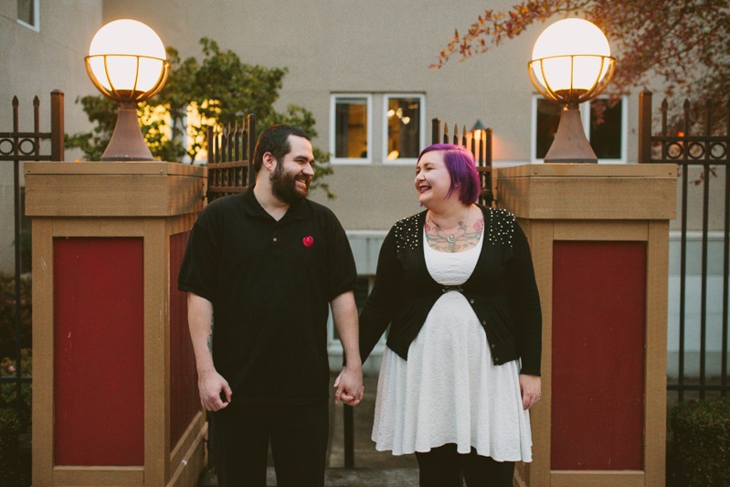 Alternative Kitsap County engagement session, with couple holding hands, and bride with purple hair. 