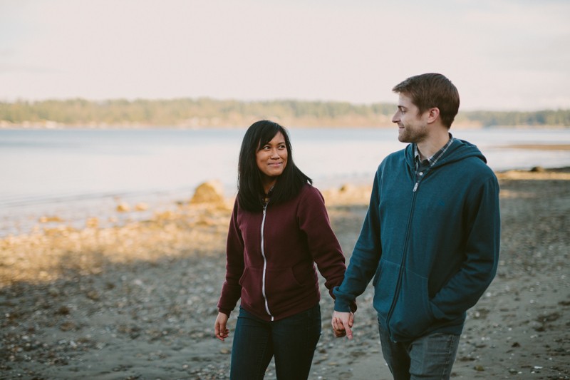 Cute portrait session with couple holding hands on the beach in Bremerton, WA. 