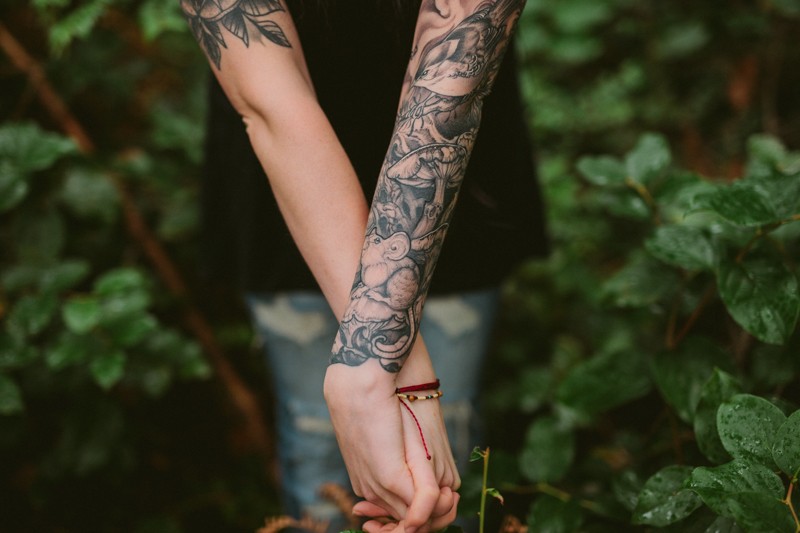 Tattoo portraits in the forest.