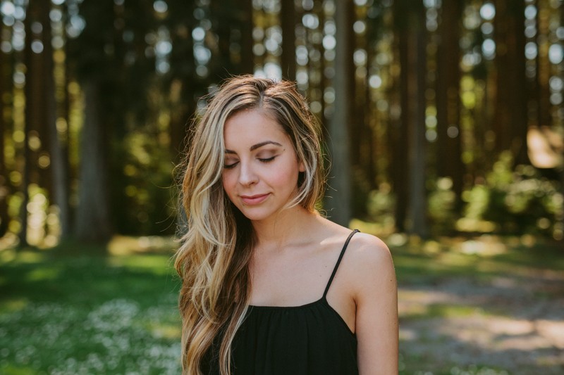 Romantic portraits of model with long hair, at Kitsap Memorial State Park in Poulsbo, WA.