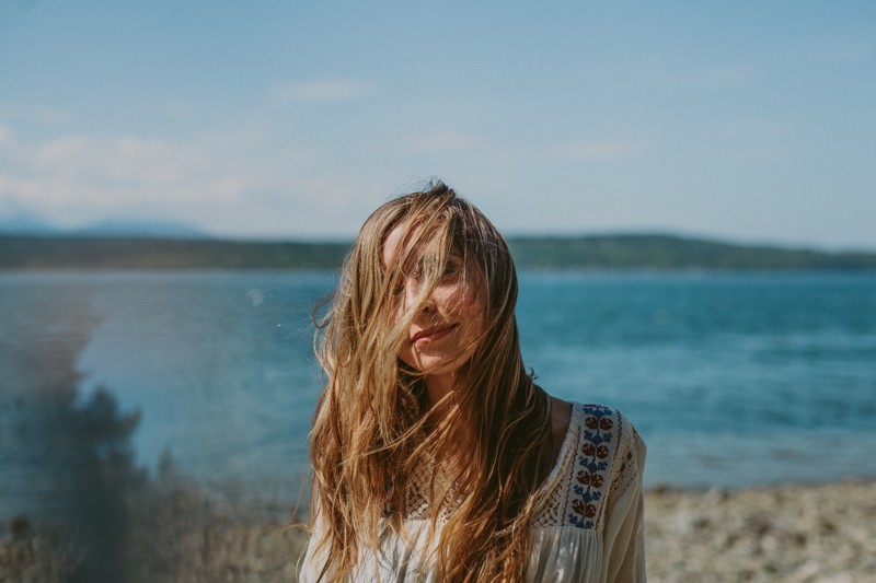 Beachy summer portraits along the Hood Canal in Poulsbo, with model in a vintage peasant top. 