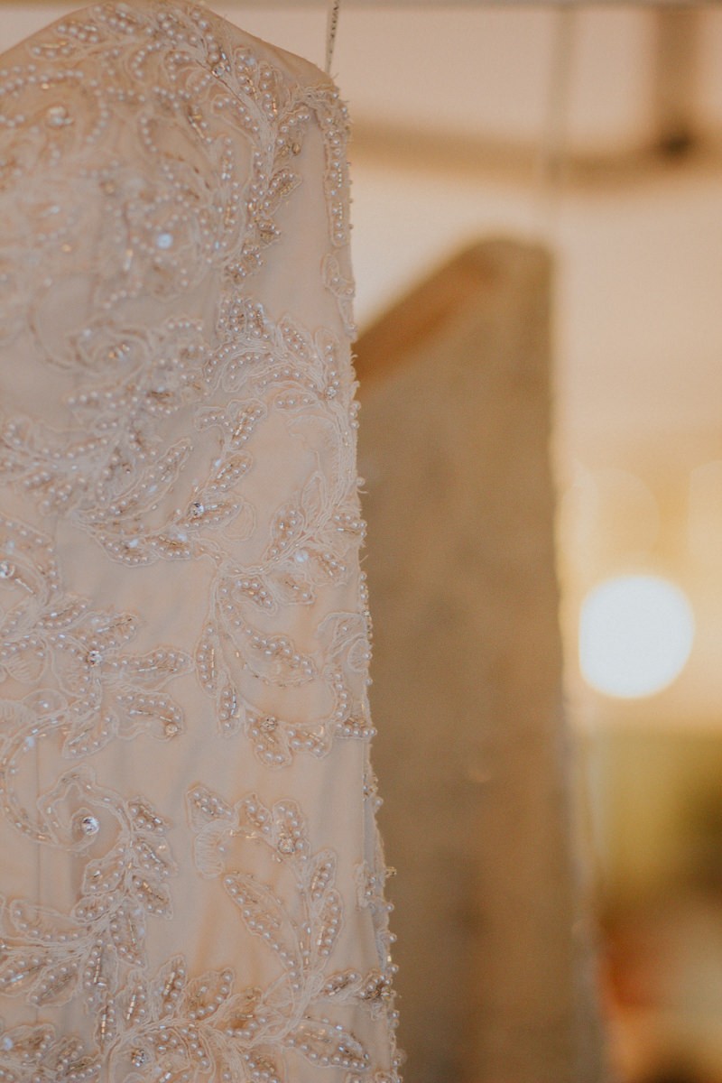 Beading detail on strapless sweetheart wedding gown. 