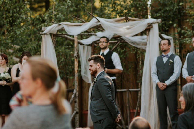 Groom waiting at the altar for the bride, at Black Diamond Gardens. 