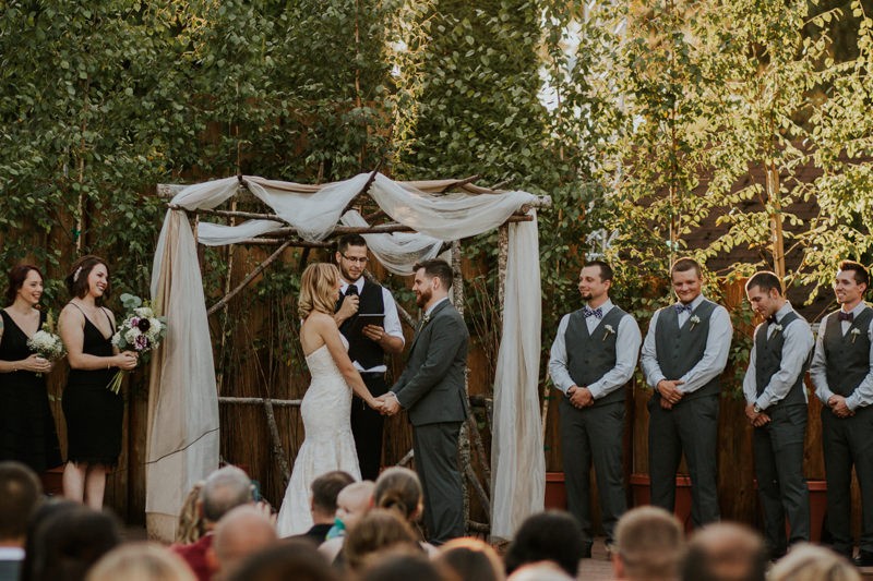 Bride and groom holding hands during their outdoor ceremony in Black Diamond, WA. 