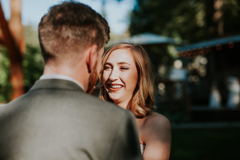 Garden bride with shoulder-length hair and a side part. 