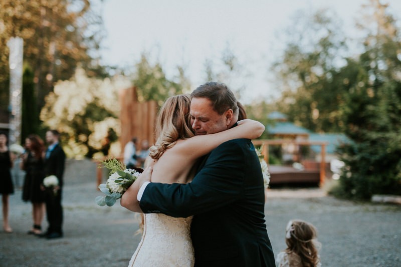 Bride hugging her father before the wedding. 