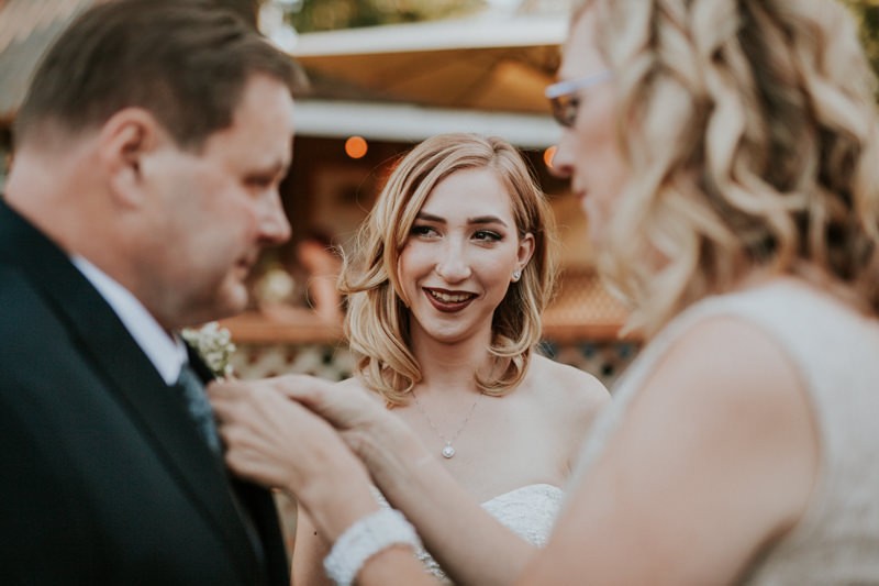 Modern garden glam bride, with shoulder-length hair and bold makeup, at Black Diamond Gardens. 