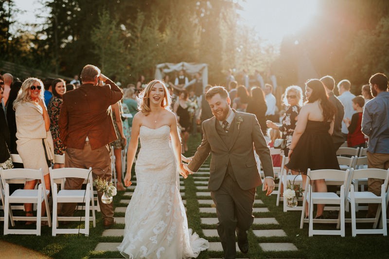 Bride and groom dance during ceremony recessional, in Black Diamond, WA.