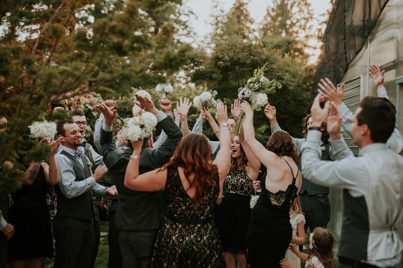 Fun wedding party cheering after ceremony, in Black Diamond, WA. 