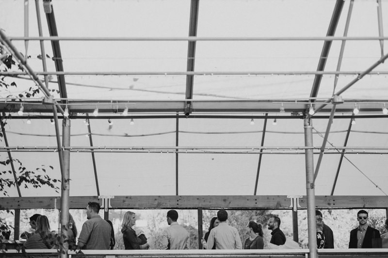 Guests waiting in line for drinks, in a greenhouse venue, in Black Diamond, WA. 