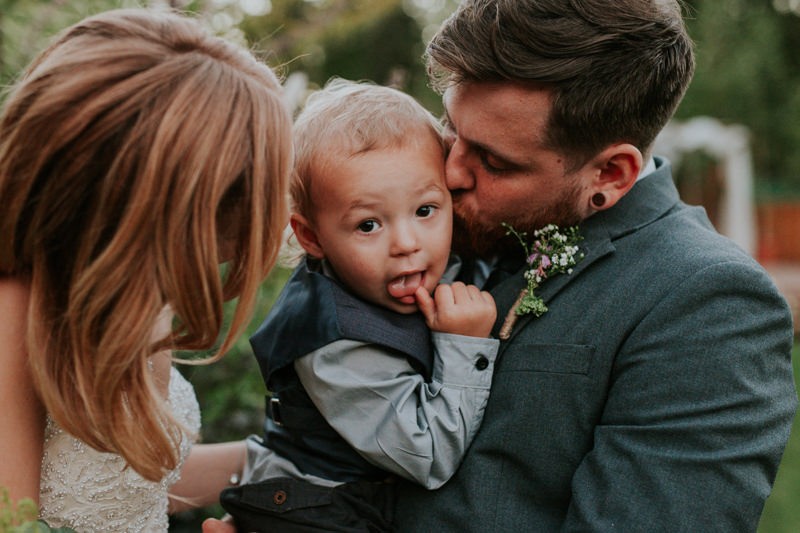 Bride and groom with their son, at their wedding in Black Diamond, WA. 