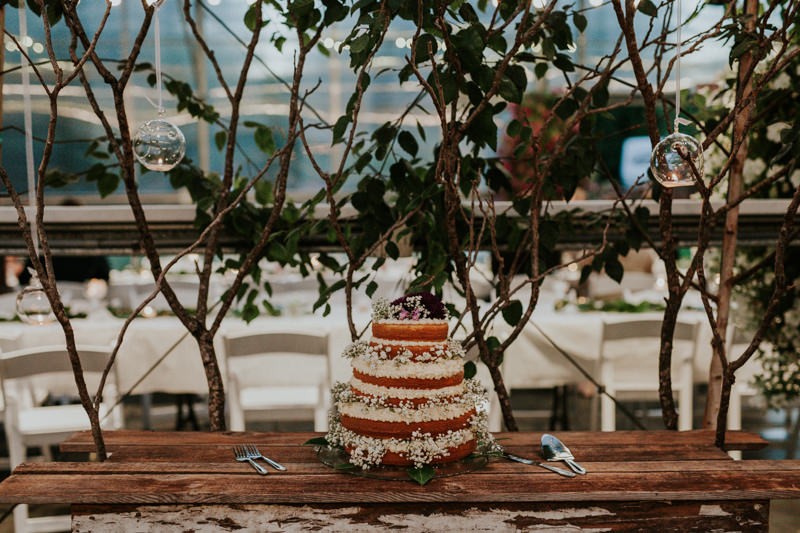 Simple naked cake, topped with Baby's Breath, for a garden wedding. 