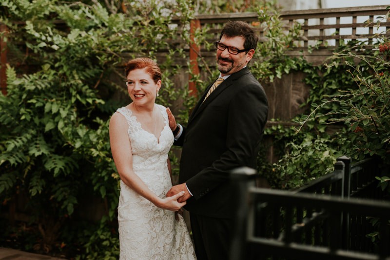 Sweet bride and groom laughing after their first look. 