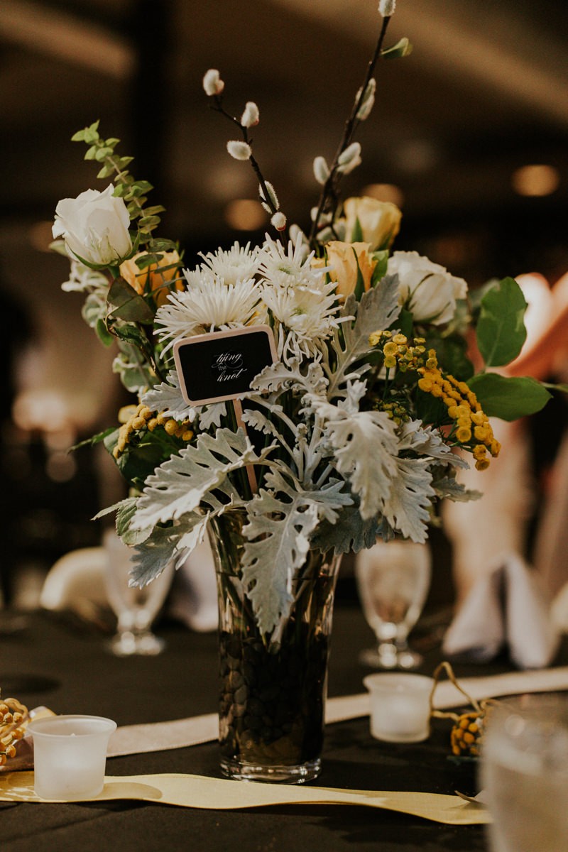 Modern floral centerpiece, with Dusty Miller, Pussy Willow branches, Roses and Mums. 