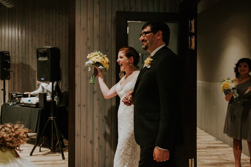 Bride and groom celebrate at The Pine Room. 