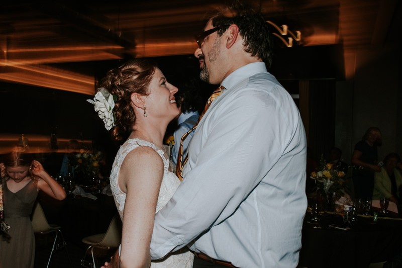 Bride and groom dance blissfully during their reception. 