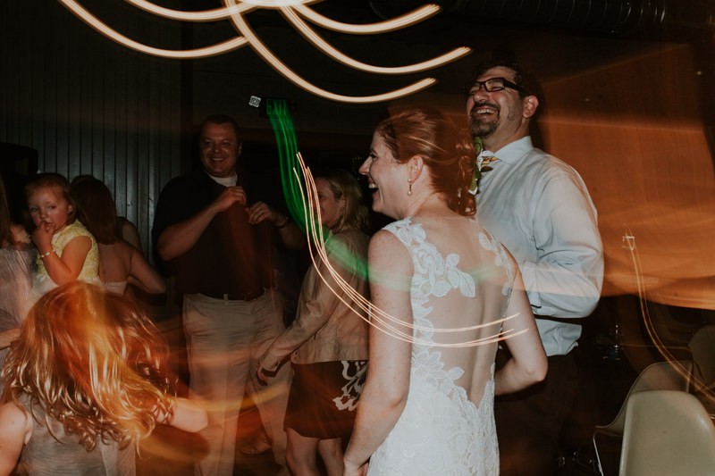 Bride and groom enjoying the lively dancing at their reception. 