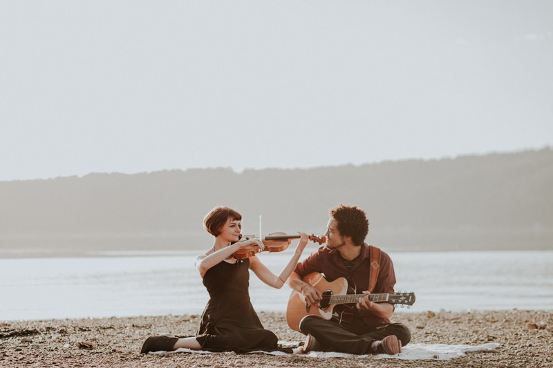 Musical portraits, with woman playing the violin and guy playing the guitar, along the Hood Canal in Union, WA. 
