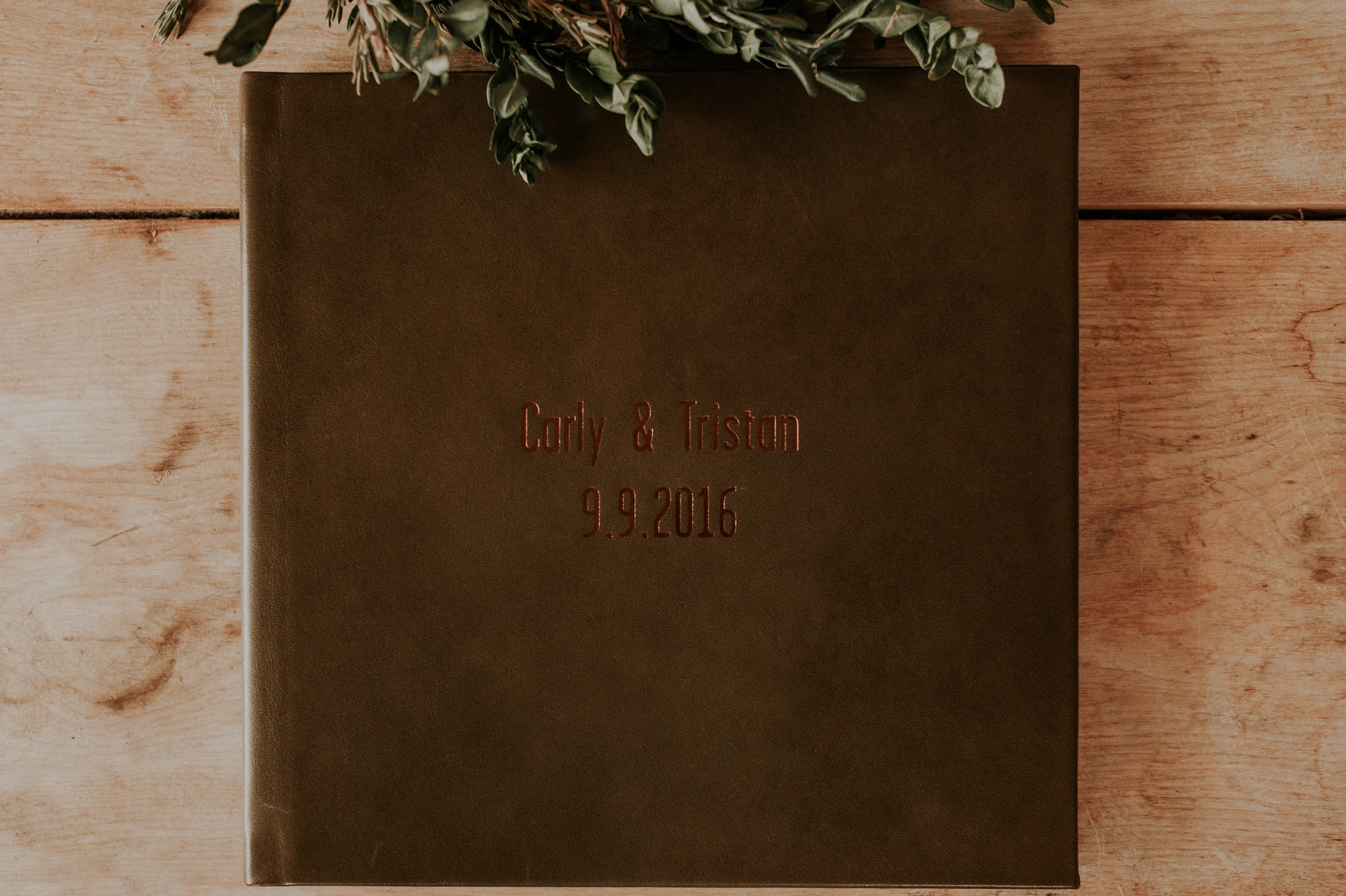 Leather heirloom wedding album with copper foil debossing on the front cover. 