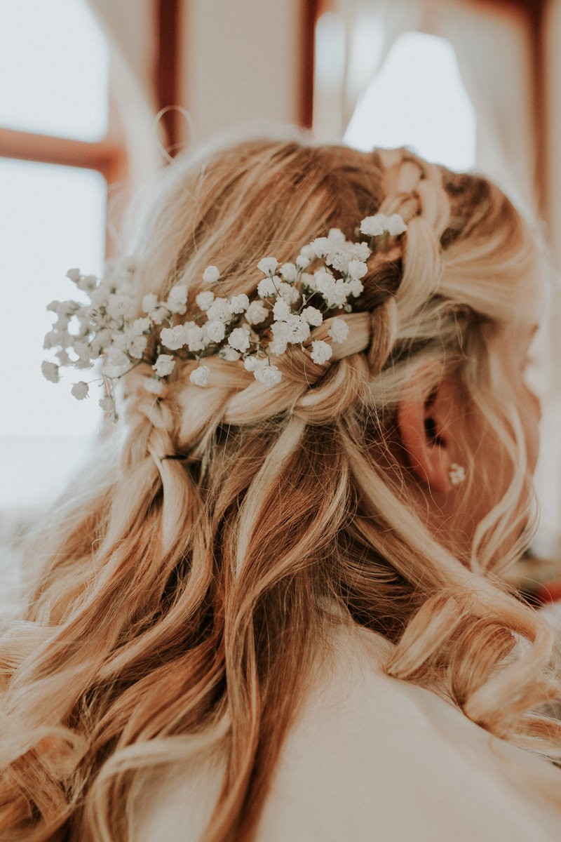 Simple romantic hairstyle for a Port Townsend elopement, with a braid and Baby's Breath. 