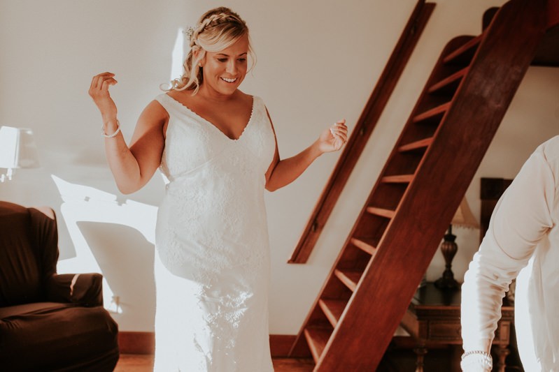 Bride wearing a sweet lace v-neck wedding dress, at Water Street Hotel in Port Townsend, WA. 