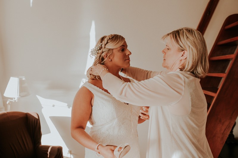 Bride getting ready with her mom before a winter elopement in Port Townsend, WA. 