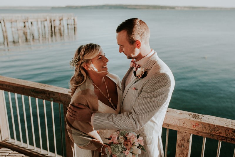 Port Townsend wedding, with bride in a lace dress and groom in a seersucker suit. 