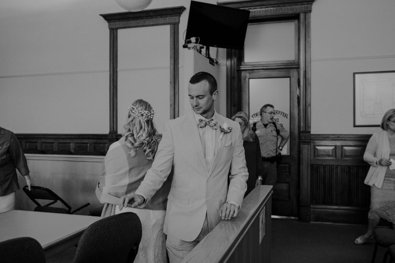Bride and groom prepare to sign papers for their courthouse wedding in Port Townsend, WA. 